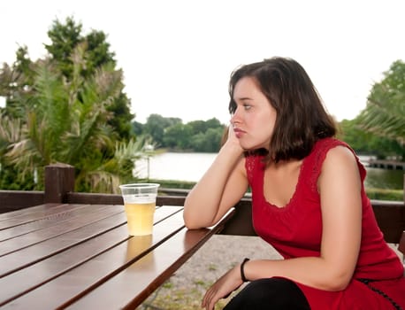 sad woman with beer