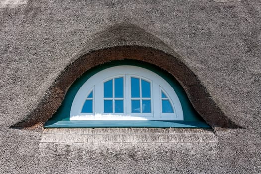 Dormer of a traditional thatched-roof house, baltic sea, germany