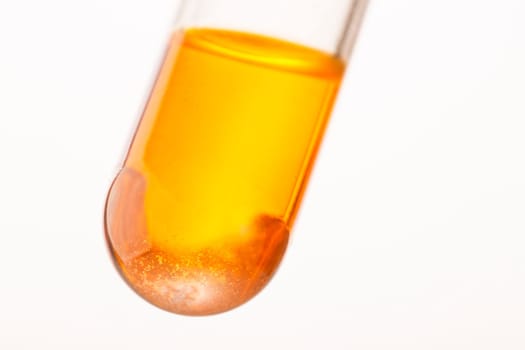 Close up of orange liquid in test tube