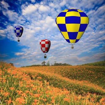 hot air balloon with green field and blue sky for adv or others purpose use