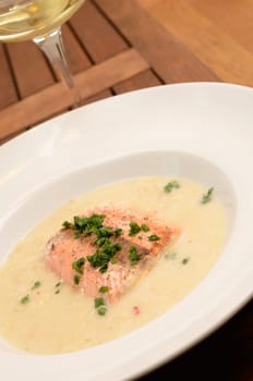 Wild salmon with creamy soup of savoy