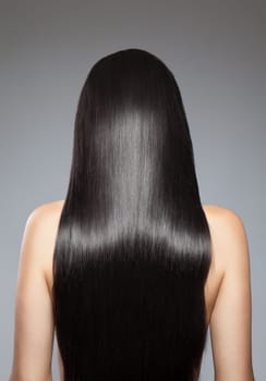 Back view of a woman with long straight hair