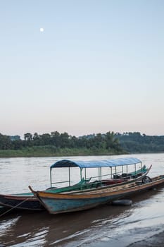 Wooden long tail boats at river