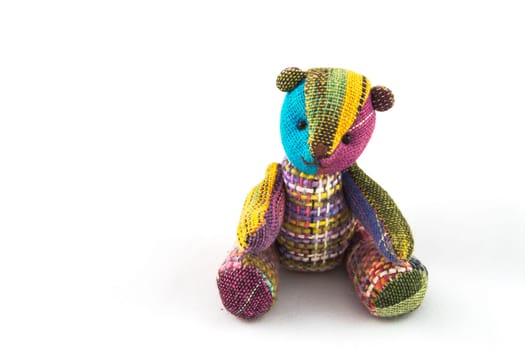 Handicraft colorful  bear on a white background