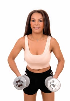 A pretty woman in black shorts standing for white background lifting.two dumbbell's for exercise..