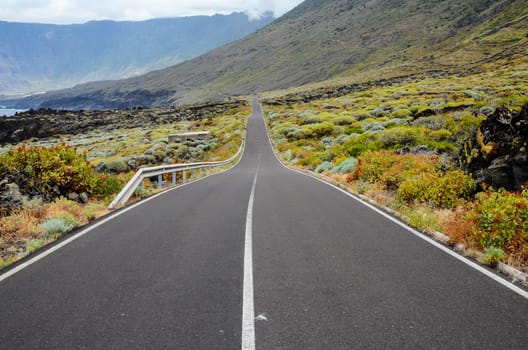 Long Empty Desert Asphalt Road in El Hierro Canary Islands Spain