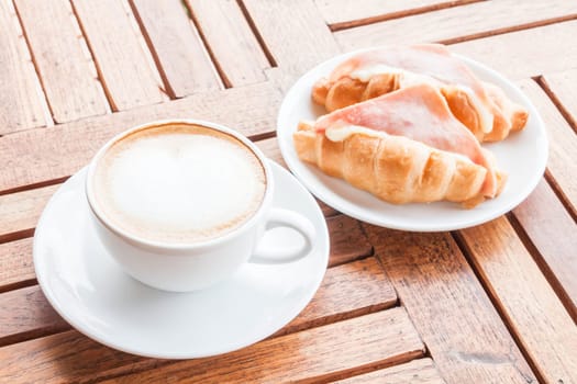 Meal set of coffee latte and croissants