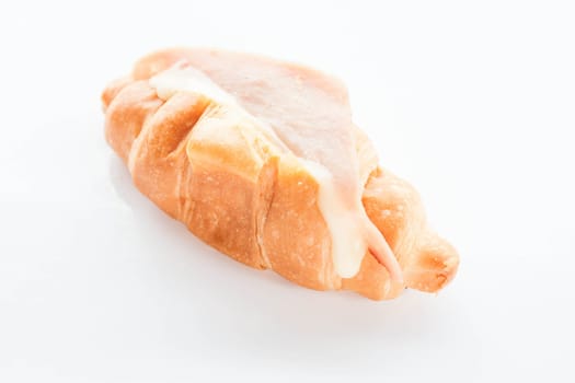 Mini ham cheese croissant isolated on white background