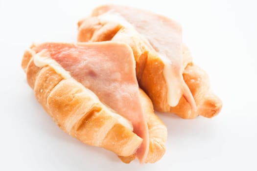 Melt ham cheese croissants isolated on white background