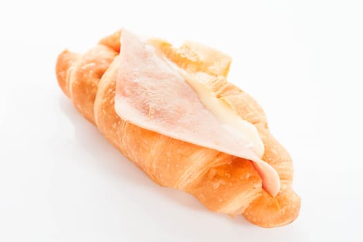 Croissant filling with ham cheese isolated on white background