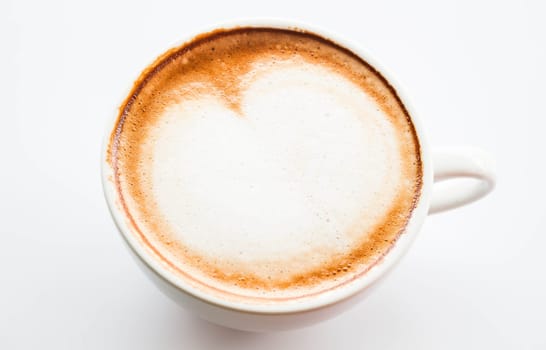 Cup of hot coffee latte with microfoam on top