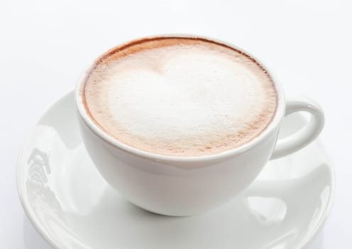 Heart shape of milk microfoam on coffee latte