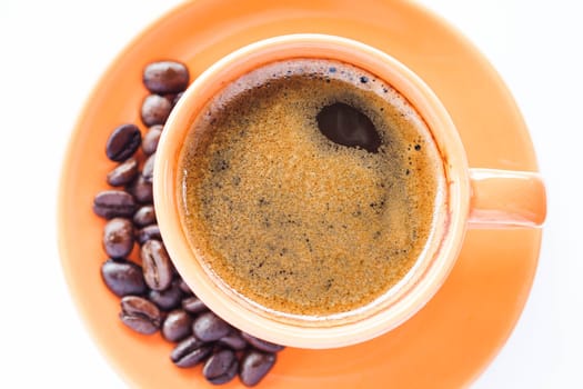Espresso cup and roasted coffee isolated on white background