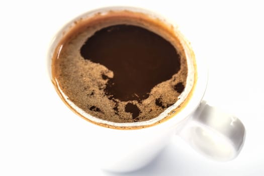 Golden ring of double espresso shots isolated on white background