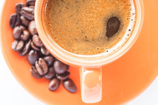 Espresso shot and roasted coffee isolated on white background