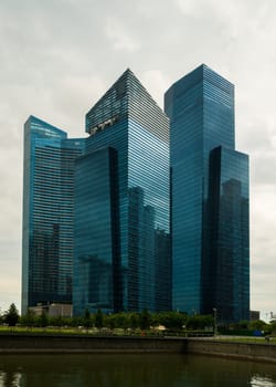 The modern and impressive skyscrapers of the Marina Bay Financial Centre in Singapore at a cloudy day