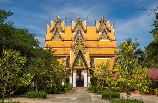 One of the impressive buildings of Wat Wang Wiwekaram in Sangkhla Buri, lovely surrounded by a green garden.