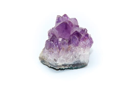 Close up of purple amethyst cluster with many points, shot on white background