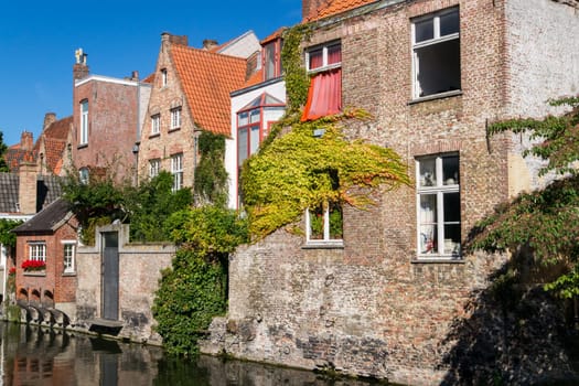 Impressions of brickwall houses along a small river in the Venice of the North, Bruges in Belgium
