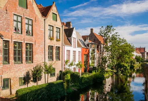 Impressions of brickwall houses along a small river in the Venice of the North, Bruges in Belgium