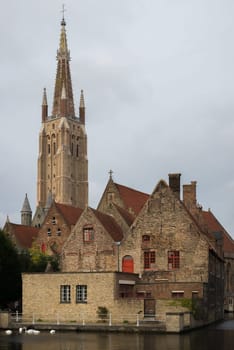 Cloudy view of the beautiful, medieval Church of Our Lady in Bruges, Belgium