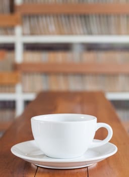 Coffee cup on wooden table, stock photo