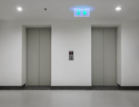 Two elevators with closed door