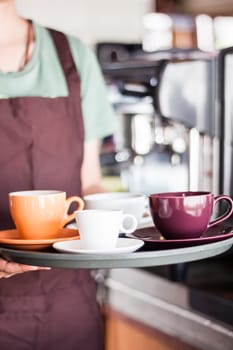 Barista serving set of freshly brewed coffee, stock photo
