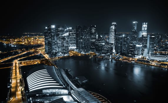 Aerial view of Singapore at night with traffic