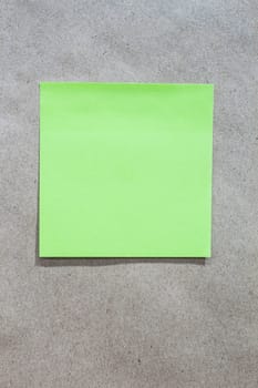 Brown gradient paper background with green note paper