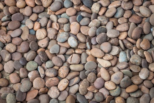 Multi colored of nature rock pebble in the garden