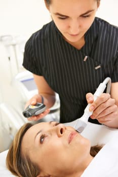 Beautician Carrying Out Ultrasound Skin Rejuvenation Treatment