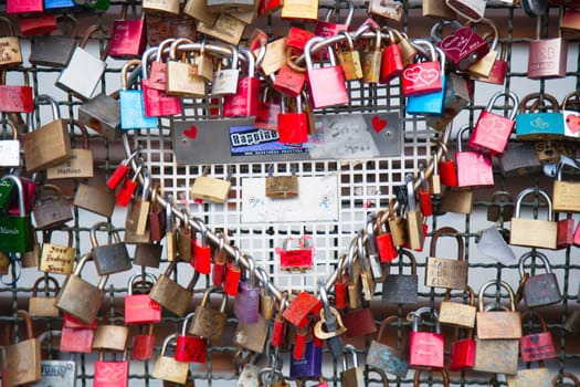 COLOGNE, GERMANY - MAY 29, 2014, Thousands of love locks which sweethearts lock to the Hohenzollern Bridge to symbolize their love on May 29 in Koln, Germany.
