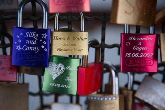 COLOGNE, GERMANY - MAY 29, 2014, Thousands of love locks which sweethearts lock to the Hohenzollern Bridge to symbolize their love on May 29 in Koln, Germany.