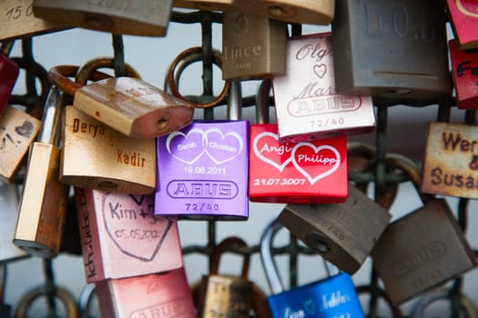 COLOGNE, GERMANY - MAY 29, 2014, Thousands of love locks which sweethearts lock to the Hohenzollern Bridge to symbolize their love on May 29 in Koln, Germany.