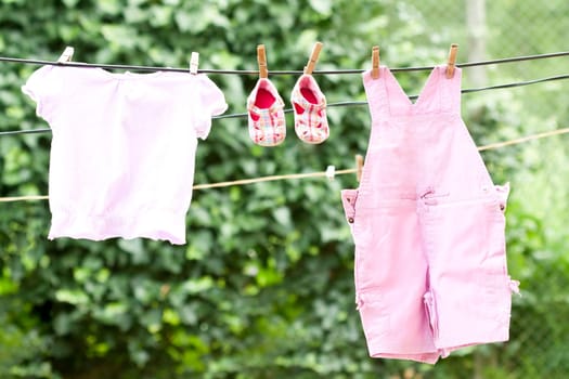 Baby clothes hanging on the clothesline