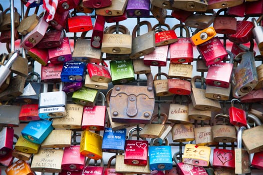 COLOGNE, GERMANY - MAY 29, 2014, Thousands of love locks which sweethearts lock to the Hohenzollern Bridge to symbolize their love on May 29 in Koln, Germany.