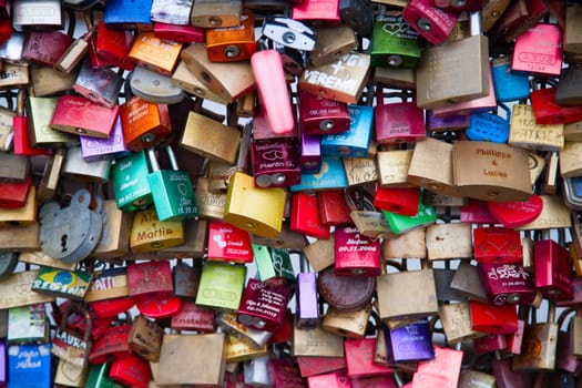 COLOGNE, GERMANY - MAY 29, 2014, Thousands of love locks which sweethearts lock to the Hohenzollern Bridge to symbolize their love on May 29 in Koln, Germany.
