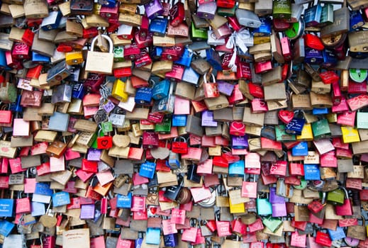 COLOGNE, GERMANY - MAY 29, 2014, Thousands of love locks which sweethearts lock to the Hohenzollern Bridge to symbolize their love on May 29 in Koln, Germany.