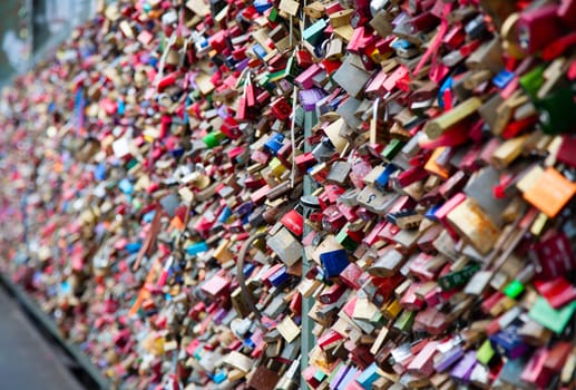 COLOGNE, GERMANY - MAY 29, 2014, Thousands of love locks which sweethearts lock to the Hohenzollern Bridge to symbolize their love on May 29 in Koln, Germany.