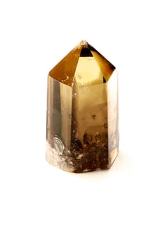 A smokey quartz crystal point standing on end, shot on white background.