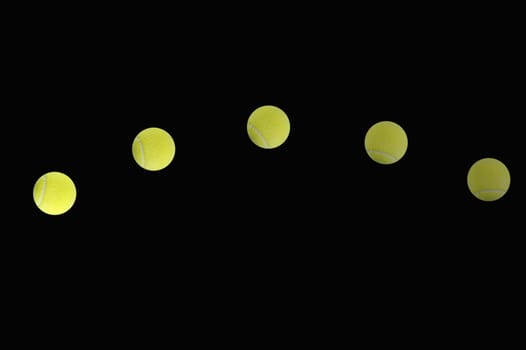 An abstract image of a tennis ball on black