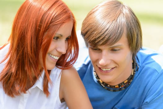 Teenage girl looking at her boyfriend enjoy summer first love