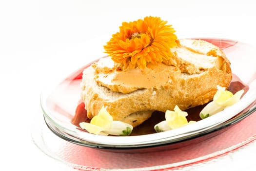 Bread rolls with tomato cream cheese and edible flowers