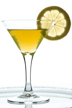 Drink in orange with lemon in a glass