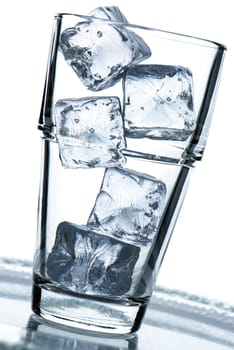 Glass with ice cubein blue backlight
