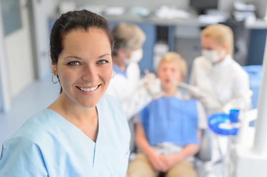 Professional dentist  team checkup teenage patient boy at dental surgery