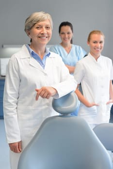 Professional dentist team three woman at dental surgery smiling portrait