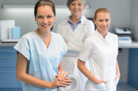 Three dentist woman team at dental surgery looking camera portrait