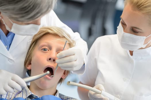 Professional dentist assistant checkup teeth teenager patient boy dental surgery